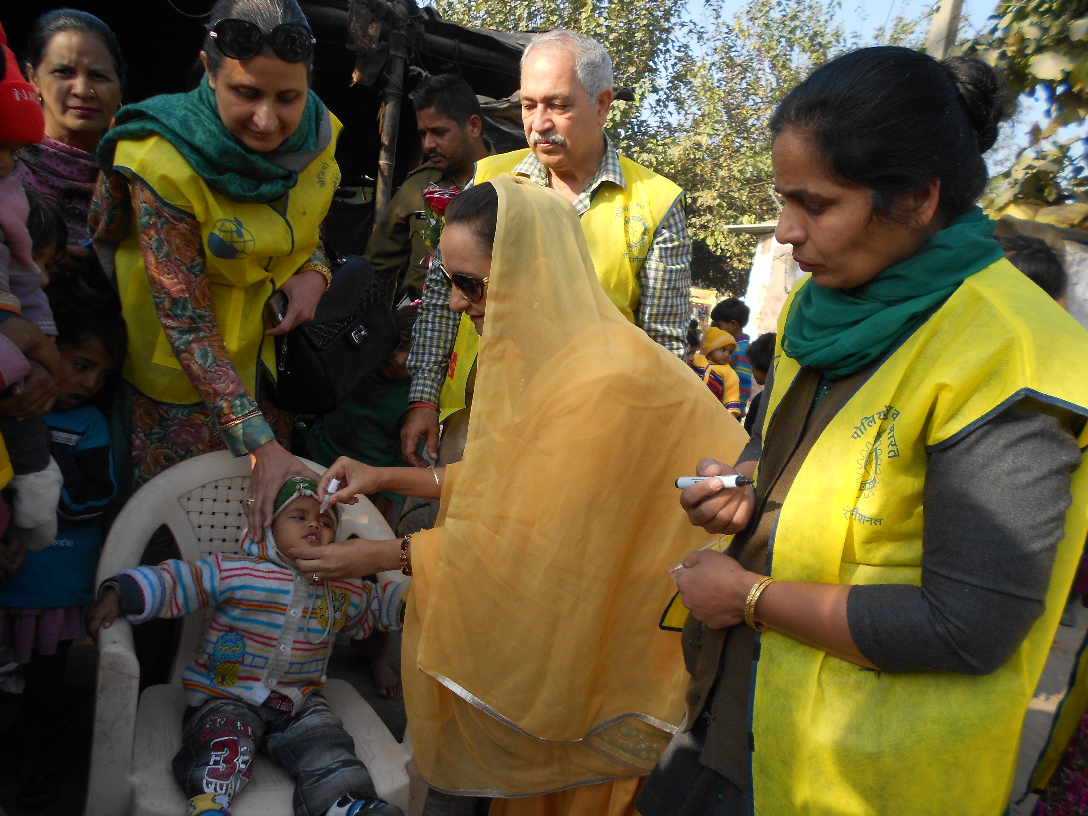 HelpingHapless Giving Polio Drops To Childs From Slums